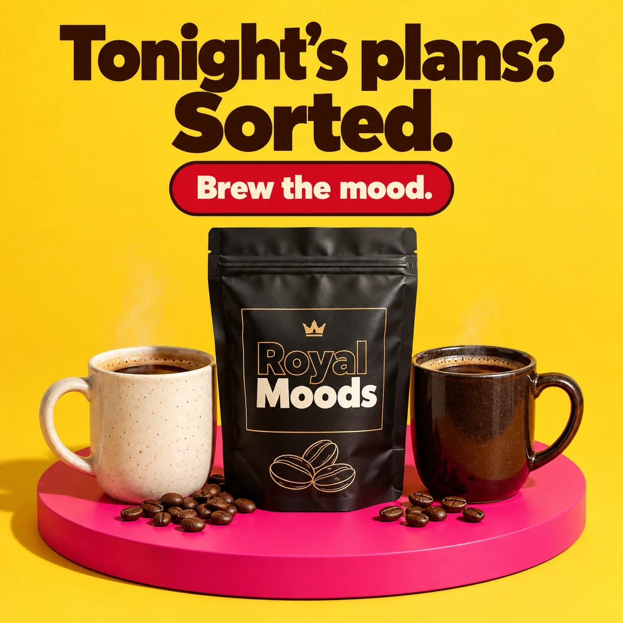 Royal Moods coffee pouch between two mugs of coffee on a pink stand
